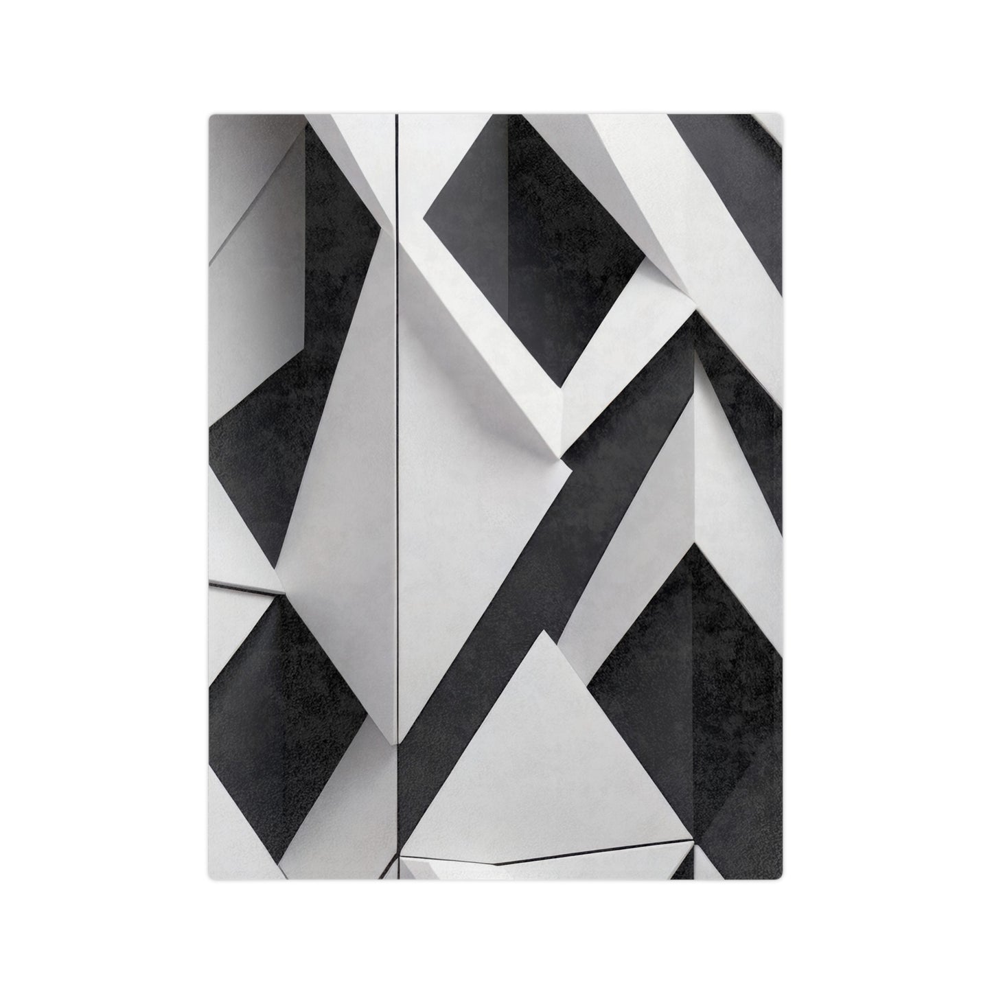Velveteen plush blanket with a black, white, and gray geometric pattern