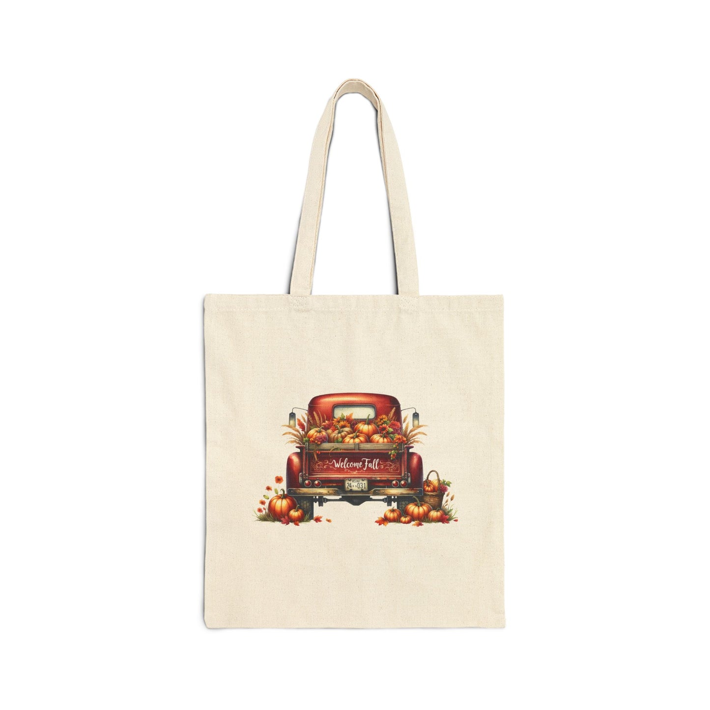 Cream-colored canvas tote bag with a vintage red truck filled with pumpkins and fall leaves