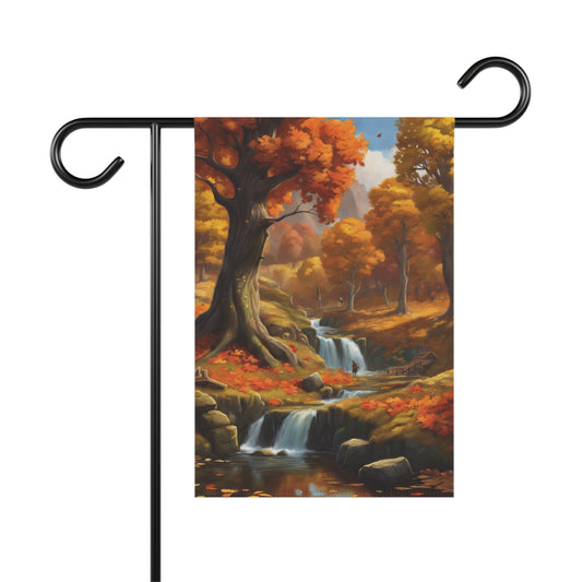 Garden flag depicting a scenic autumn landscape with multiple cascading waterfalls flowing through a forest of trees with orange and yellow fall foliage, with fallen leaves on the ground