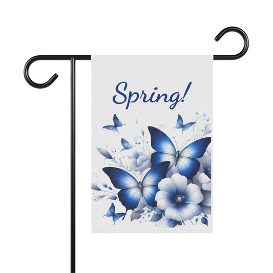 White garden flag with "Spring!" in dark blue, featuring multiple blue butterflies and blue and white flowers.