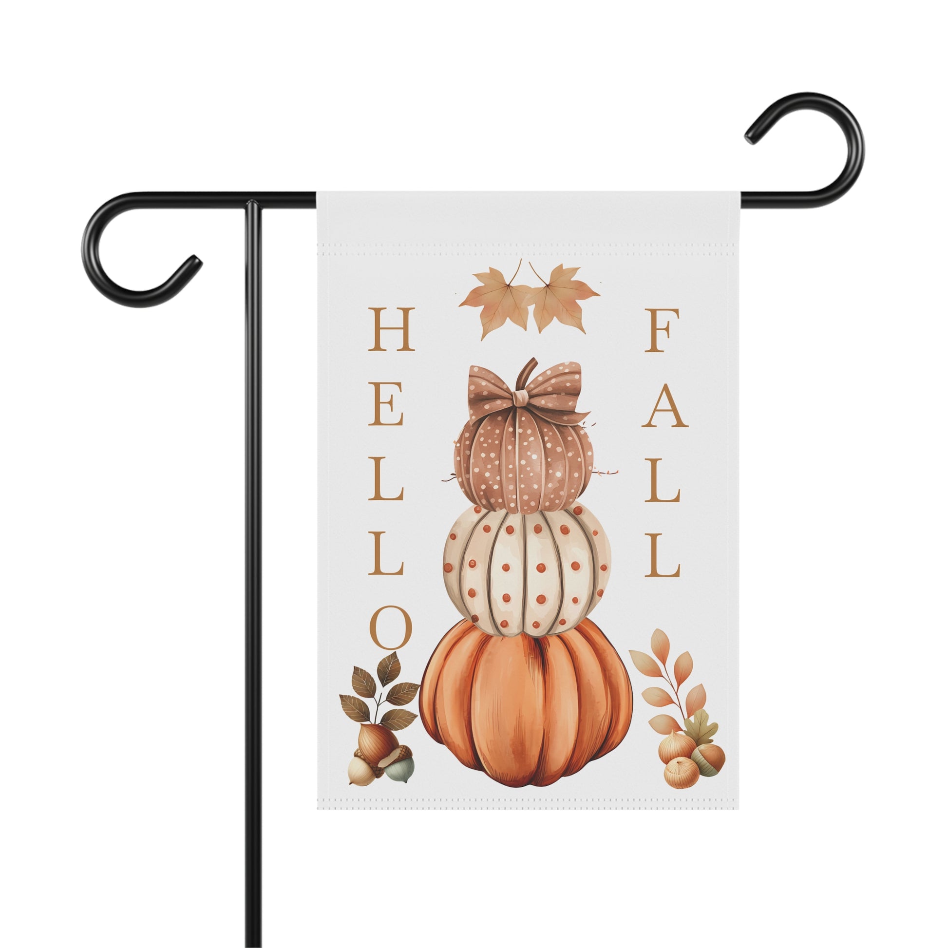 White garden flag featuring a vertical stack of three pumpkins. The top two pumpkins have decorative bows. The word "HELLO" is written vertically to the left of the pumpkins, and "FALL" is written vertically to the right. Small fall leaves and acorns are also depicted.