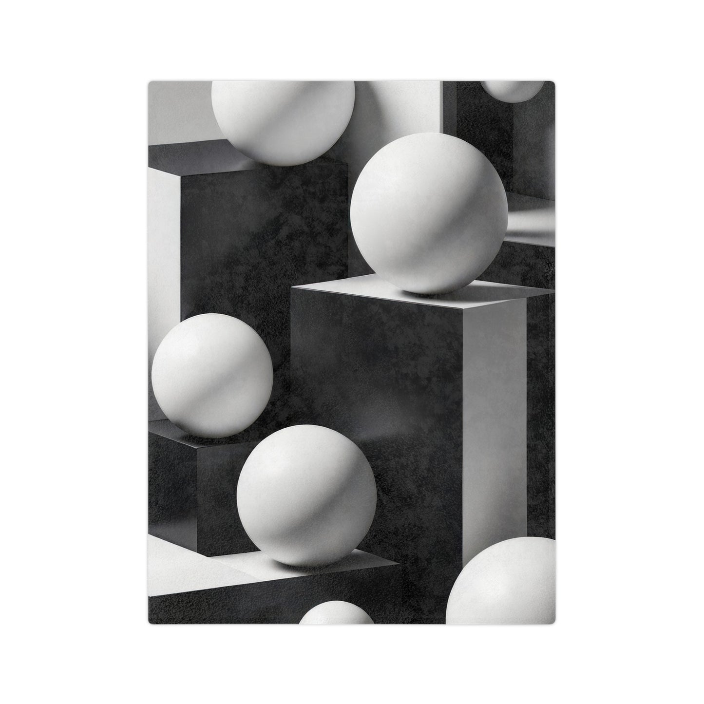 A vibrant velveteen blanket featuring a black and white abstract geometric design of cubes and spheres.