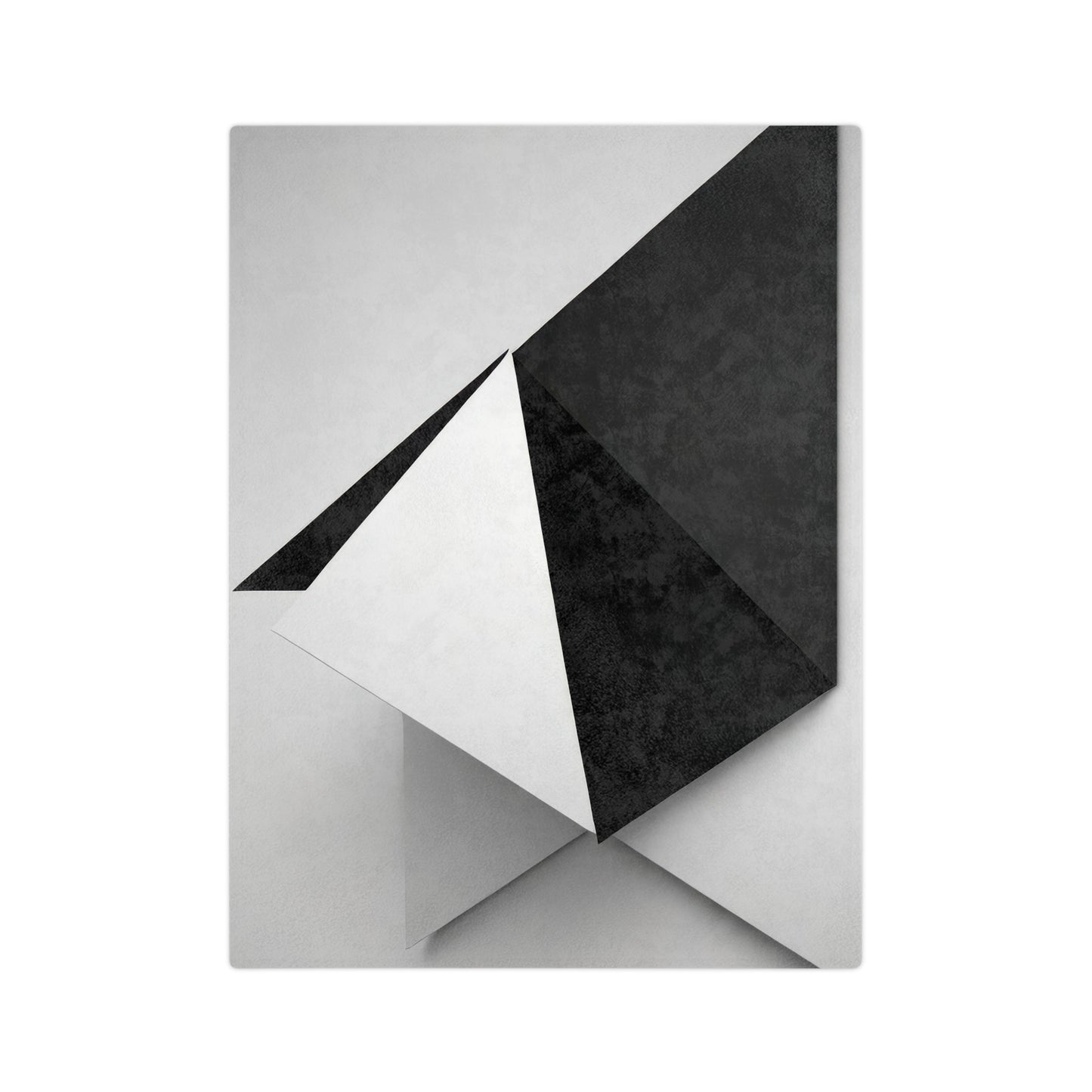 Velveteen plush blanket with a black and white geometric pattern