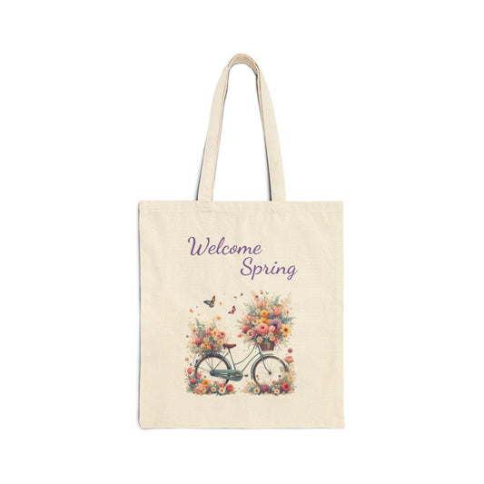 Canvas tote bag with a "Welcome Spring" print featuring a vintage bicycle with baskets full of flowers.