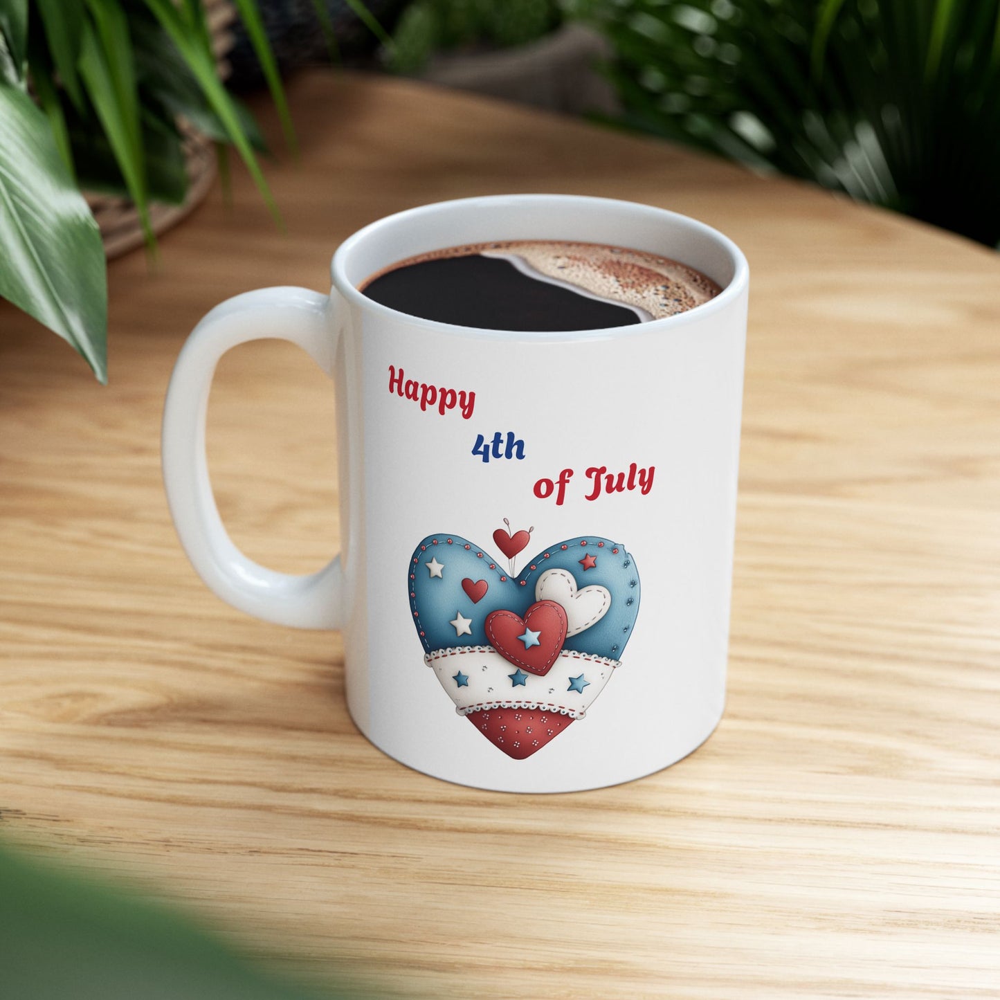 White ceramic coffee mug with 'Happy 4th of July' text and a large, decorative red, white, and blue heart with stitched details and stars