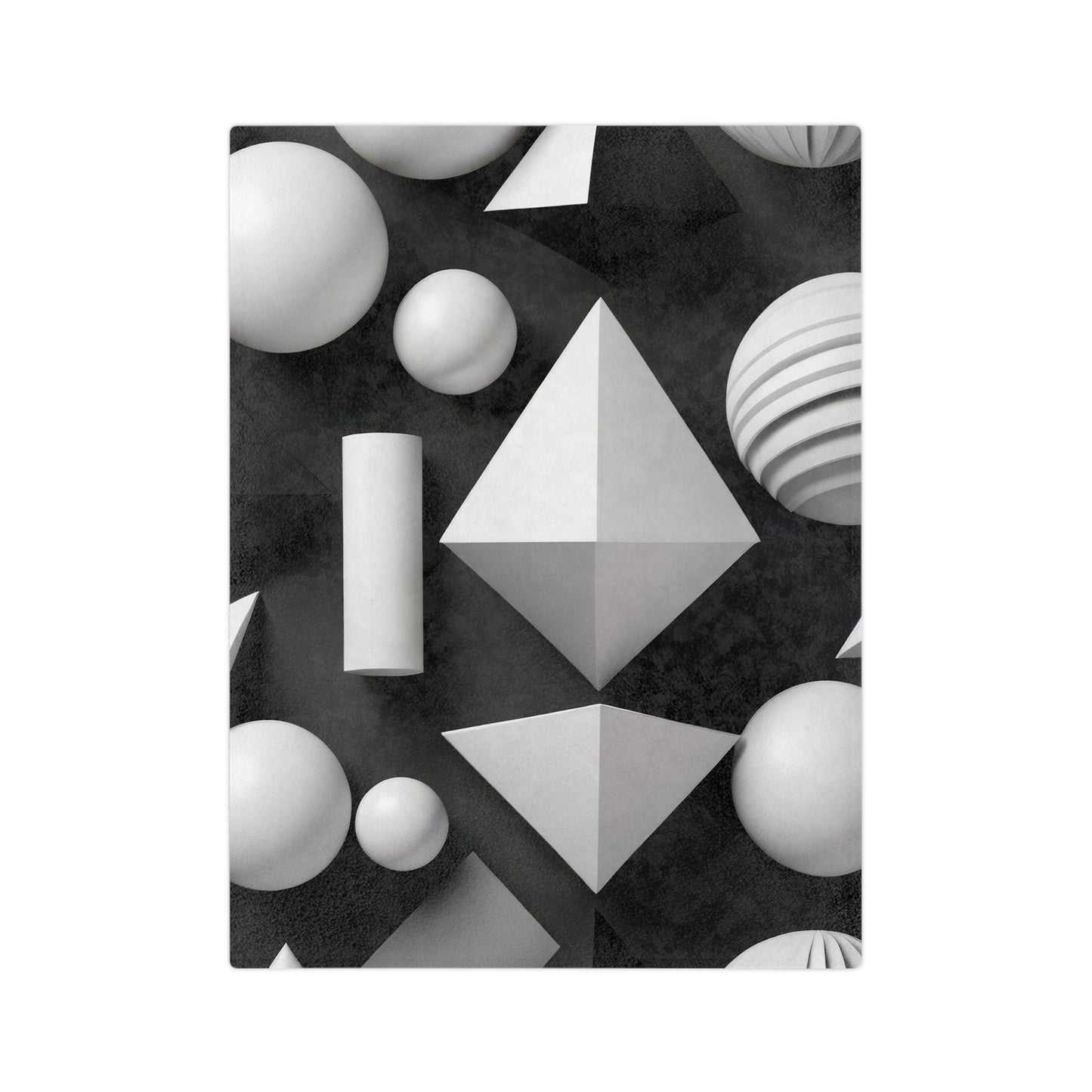 Velveteen plush blanket with a 3D black and white geometric pattern on a light wood floor.