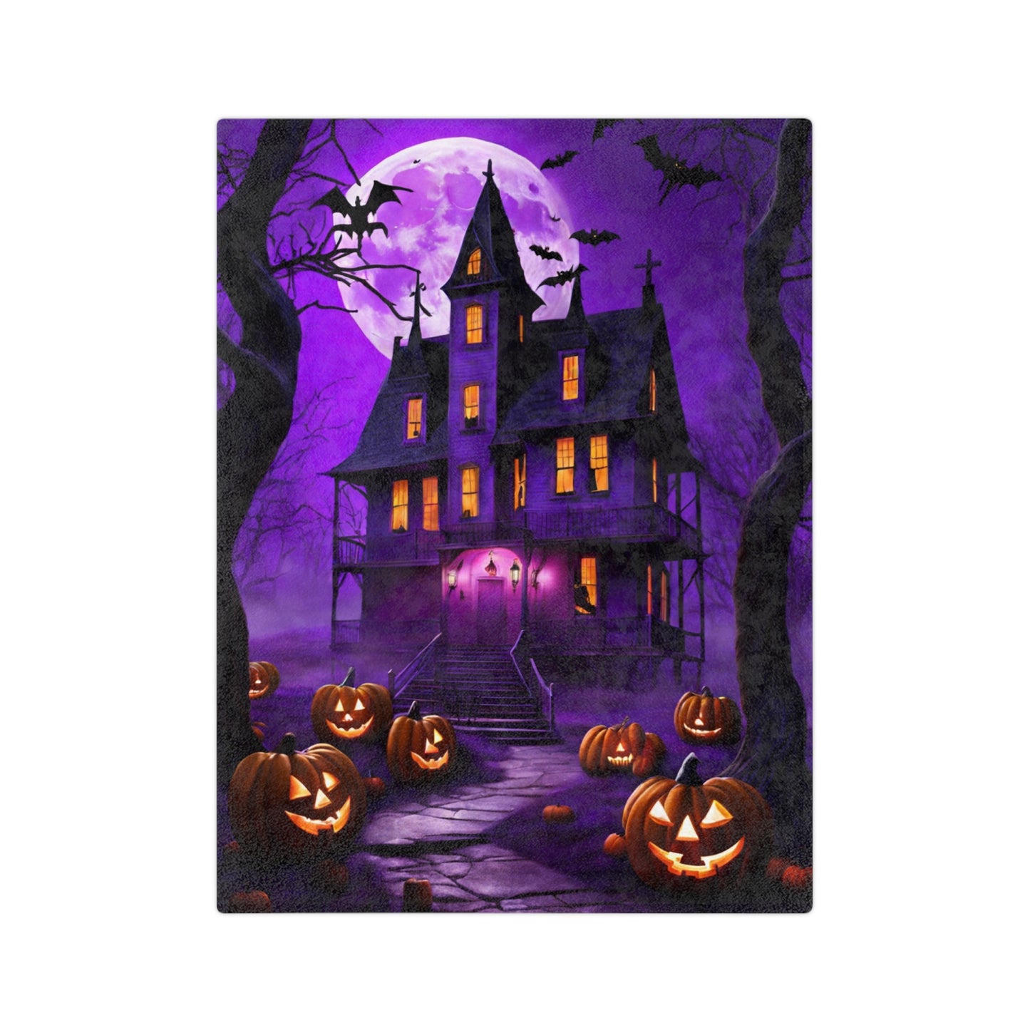 A plush Halloween throw blanket featuring a spooky gothic haunted house under a large purple full moon, with glowing jack-o'-lanterns and bats flying in the foreground.
