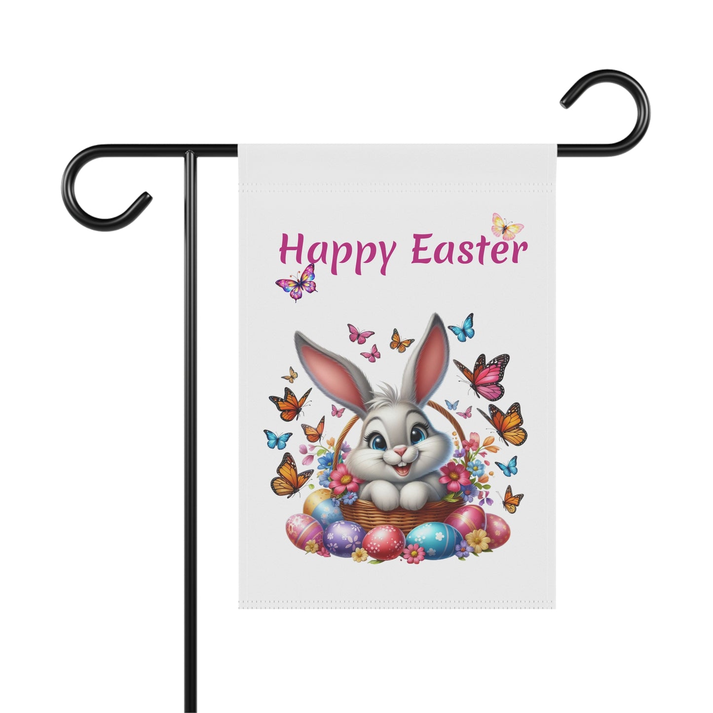 White garden flag with "Happy Easter" in pink text, featuring a cute gray cartoon bunny sitting in a woven basket filled with flowers and colorful Easter eggs, surrounded by many vibrant butterflies. The flag is displayed on a black metal garden flag stand.