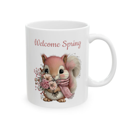 White ceramic mug printed with pink Welcome Spring text and a cute squirrel in a scarf holding a flower bouquet