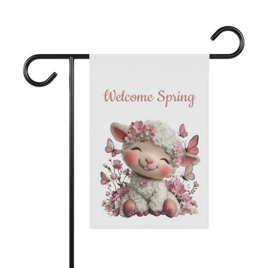 Spring garden flag featuring a happy smiling white lamb wearing a flower crown surrounded by pink butterflies and cherry blossoms under pink script text reading Welcome Spring.