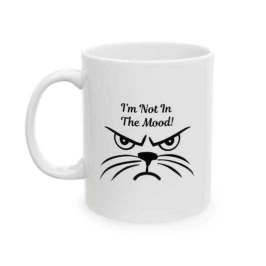 White ceramic coffee mug with a grumpy black cat face and the text "I'm Not In The Mood!".