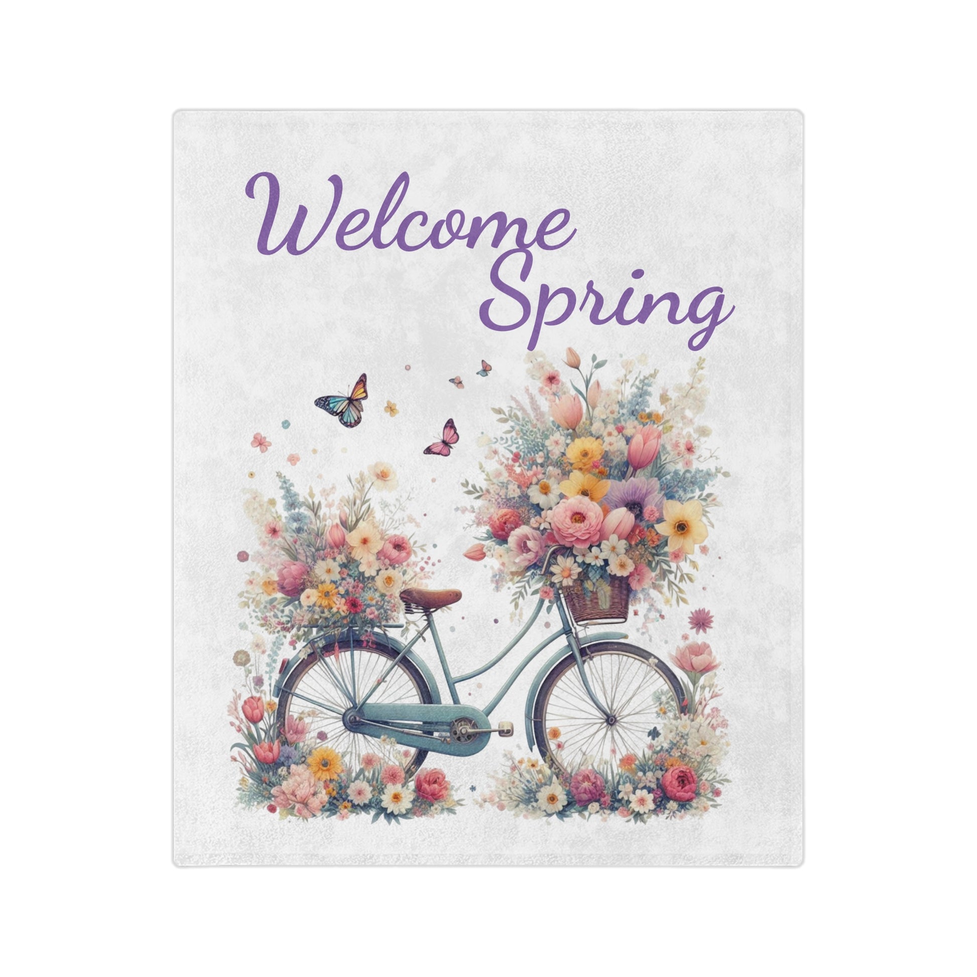 A soft "Welcome Spring" velveteen blanket featuring a watercolor illustration of a floral-filled bicycle with butterflies.

