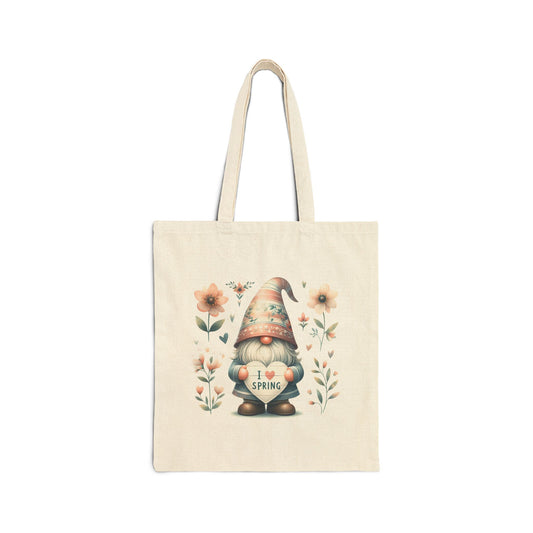 Canvas tote bag with a watercolor-style print of a garden gnome holding a heart that says "I Love Spring," surrounded by flowers.
