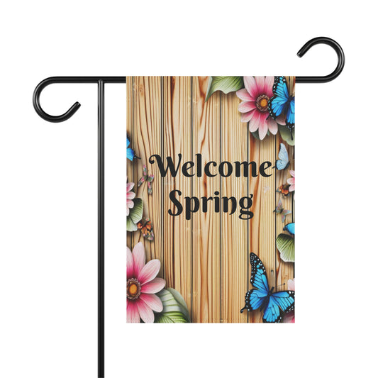 Welcome Spring garden flag with blue butterflies and pink flowers on rustic wood plank background, seasonal outdoor yard decoration