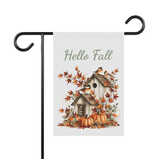 Outdoor garden flag featuring a rustic birdhouse illustration beneath sage green text reading Hello Fall.