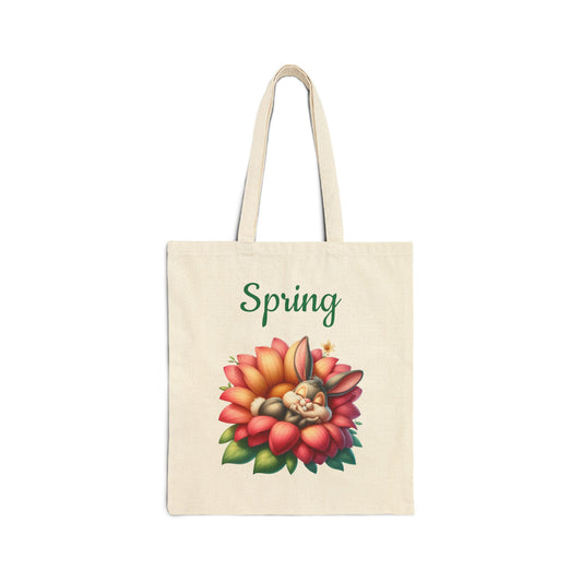 Canvas tote bag with a "Spring" print and a cute illustration of a sleeping bunny inside a red and orange flower.
