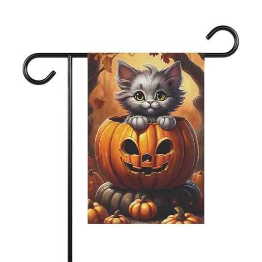 Cute kitten in jack-o’-lantern on Halloween garden flag with autumn leaves and pumpkins