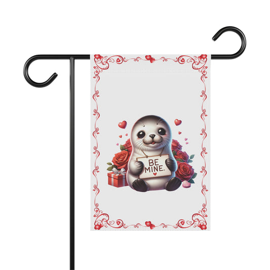 Cute Valentine garden flag with seal holding “Be Mine” sign, red roses, hearts, and gift box
