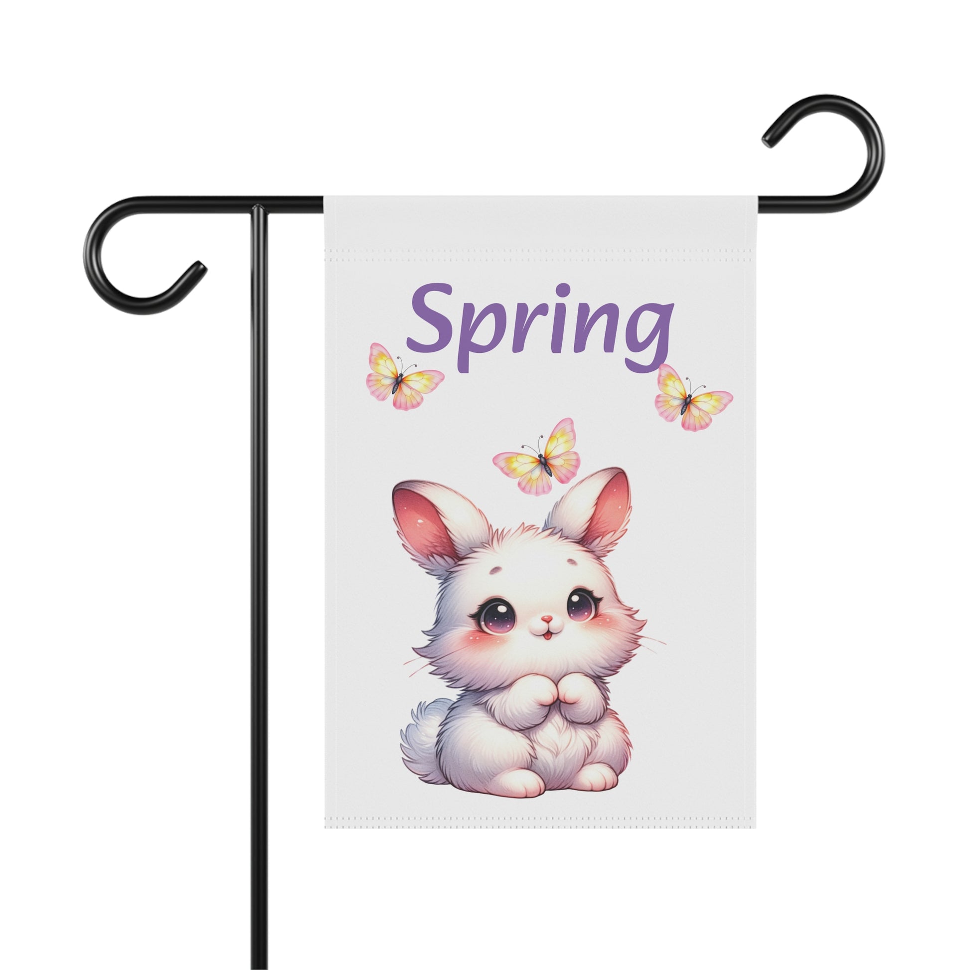 White garden flag displayed on a black metal pole, featuring a cute white cartoon bunny rabbit with rosy cheeks and sparkling eyes, three yellow butterflies, and the word "Spring" in purple script.

