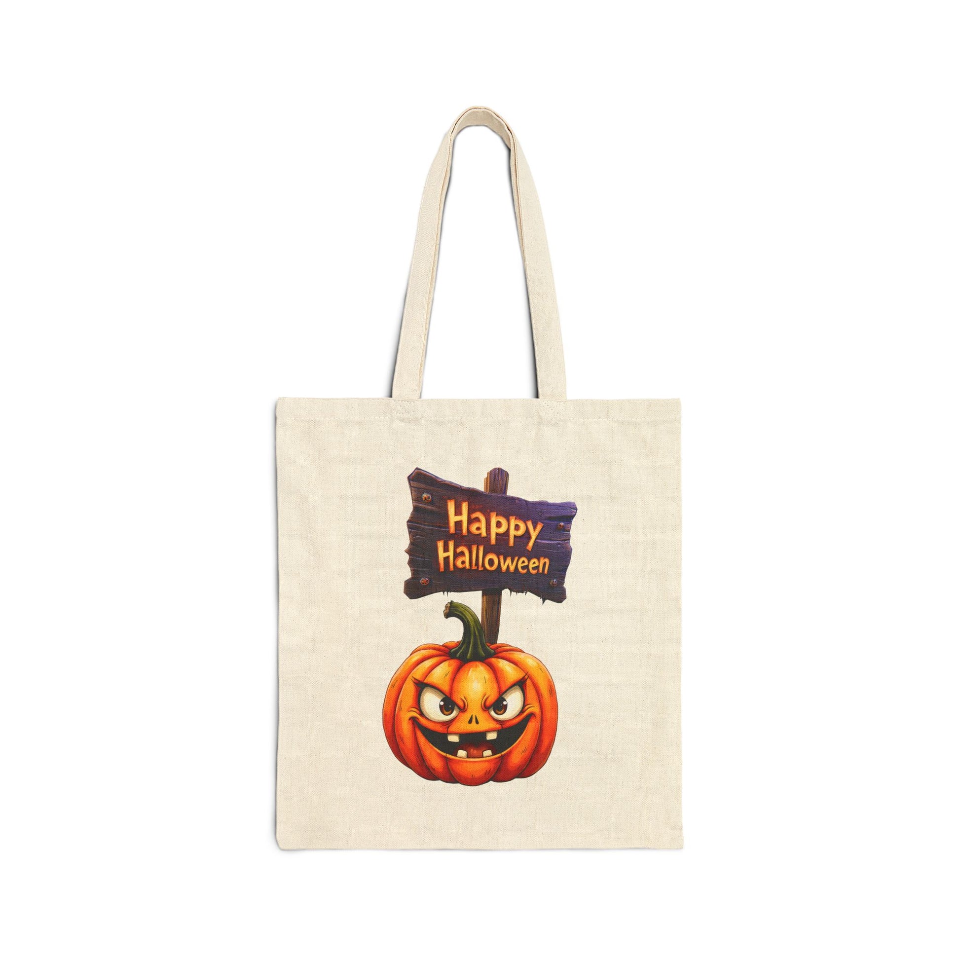 A cream-colored 100% cotton canvas tote bag featuring an illustration of a carved, spooky jack-o'-lantern with a wide grin next to a wooden sign that says "Happy Halloween."