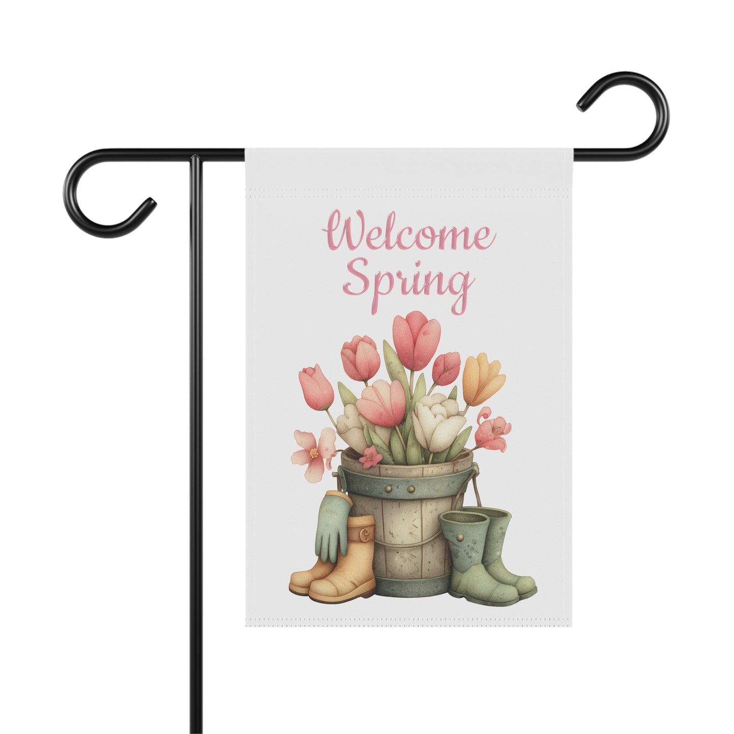 Soft pink and yellow tulips in a wooden bucket with gardening boots under pink Welcome Spring text garden flag