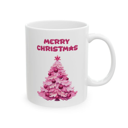 Close-up of a white mug showing a pink Christmas tree graphic.