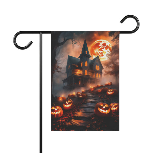 Haunted house garden flag with glowing jack-o’-lanterns, spooky trees, and a full orange moon

