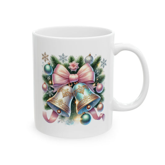 White ceramic coffee mug printed with an illustration of ornate silver and mint green Christmas bells topped with a large pastel pink bow and evergreen sprigs