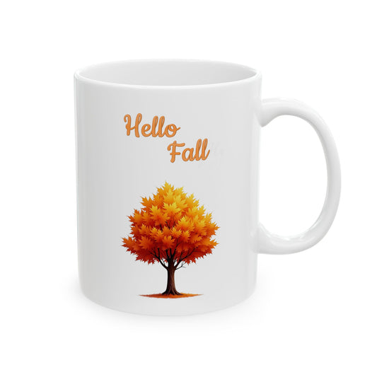 White ceramic coffee mug with a "Hello Fall" design and a golden autumn tree.


