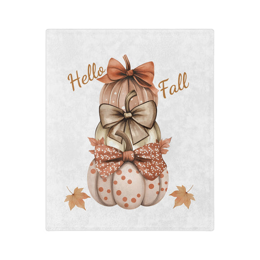 Lightweight velveteen blanket with a "Hello Fall" design featuring three stacked pastel-colored pumpkins with decorative bows, and two small autumn leaves at the bottom.

