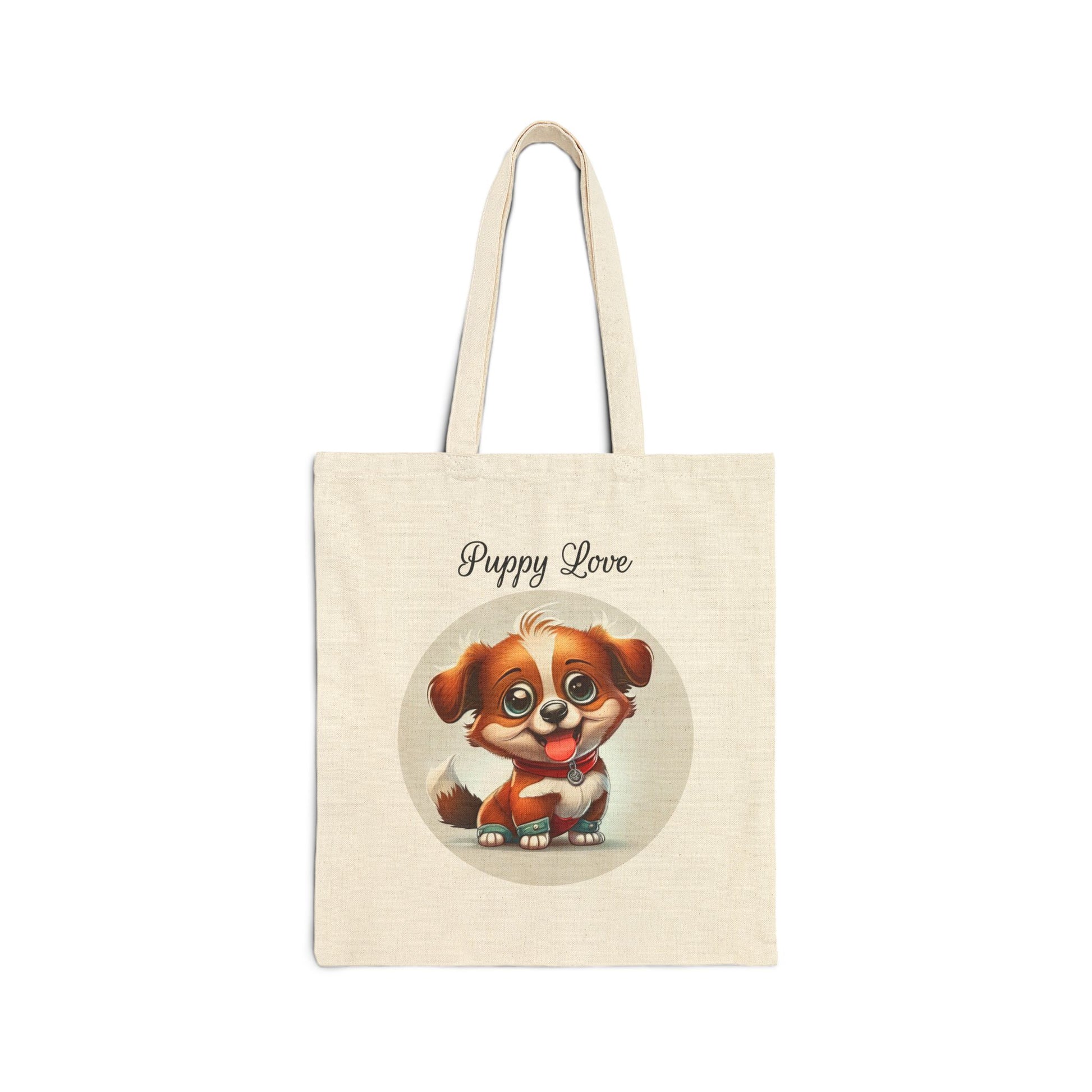  A cream-colored 100% cotton canvas tote bag featuring a circular illustration of a small, cute brown and white puppy with big eyes and its tongue out, with the words "Puppy Love" above it.
