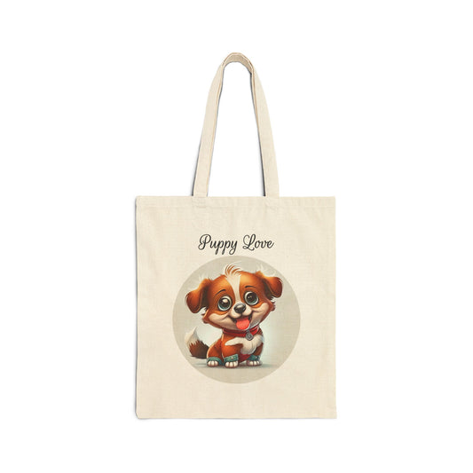  A cream-colored 100% cotton canvas tote bag featuring a circular illustration of a small, cute brown and white puppy with big eyes and its tongue out, with the words "Puppy Love" above it.