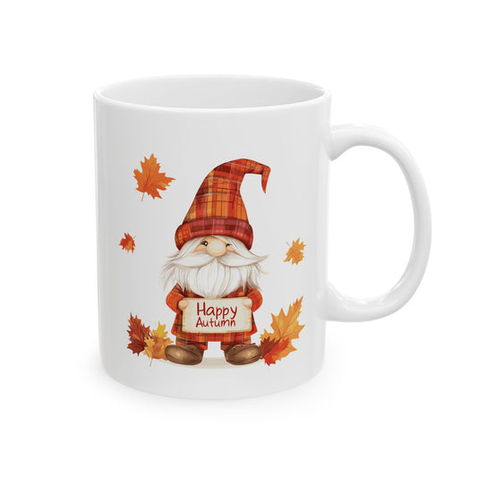 White ceramic coffee mug featuring a cartoon gnome with a plaid hat, a white beard, and a sign that says "Happy Autumn" surrounded by fall leaves.


