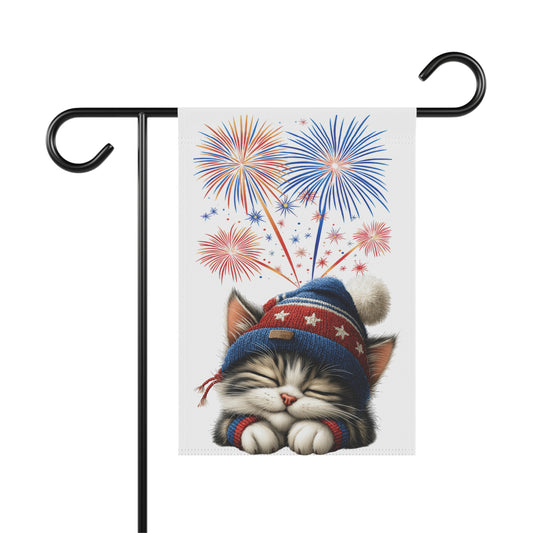 Sleepy patriotic kitten garden flag wearing a red, white, and blue hat with fireworks in the background, cute 4th of July decor, cat lover flag.

