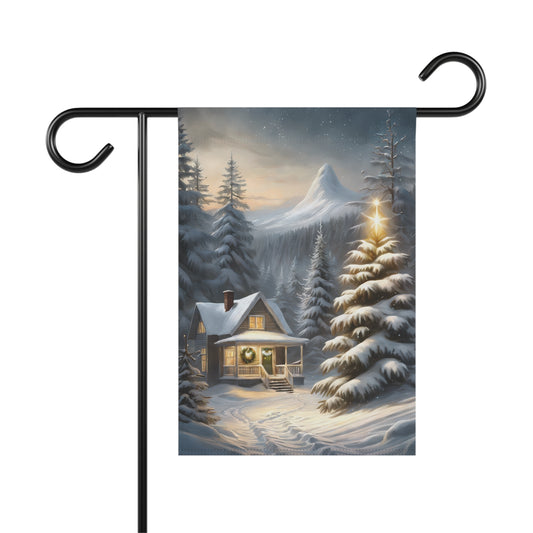 Cozy winter cabin garden flag with a snow-covered house, illuminated Christmas tree, snowy pine trees, and a mountain in the background, on a black metal garden flag stand.

