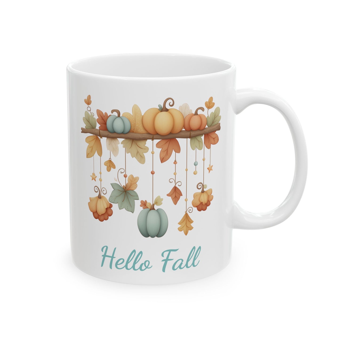 White ceramic coffee mug featuring a watercolor illustration of a branch garland with hanging pastel pumpkins, autumn leaves, and stars under the words Hello Fall in teal script.