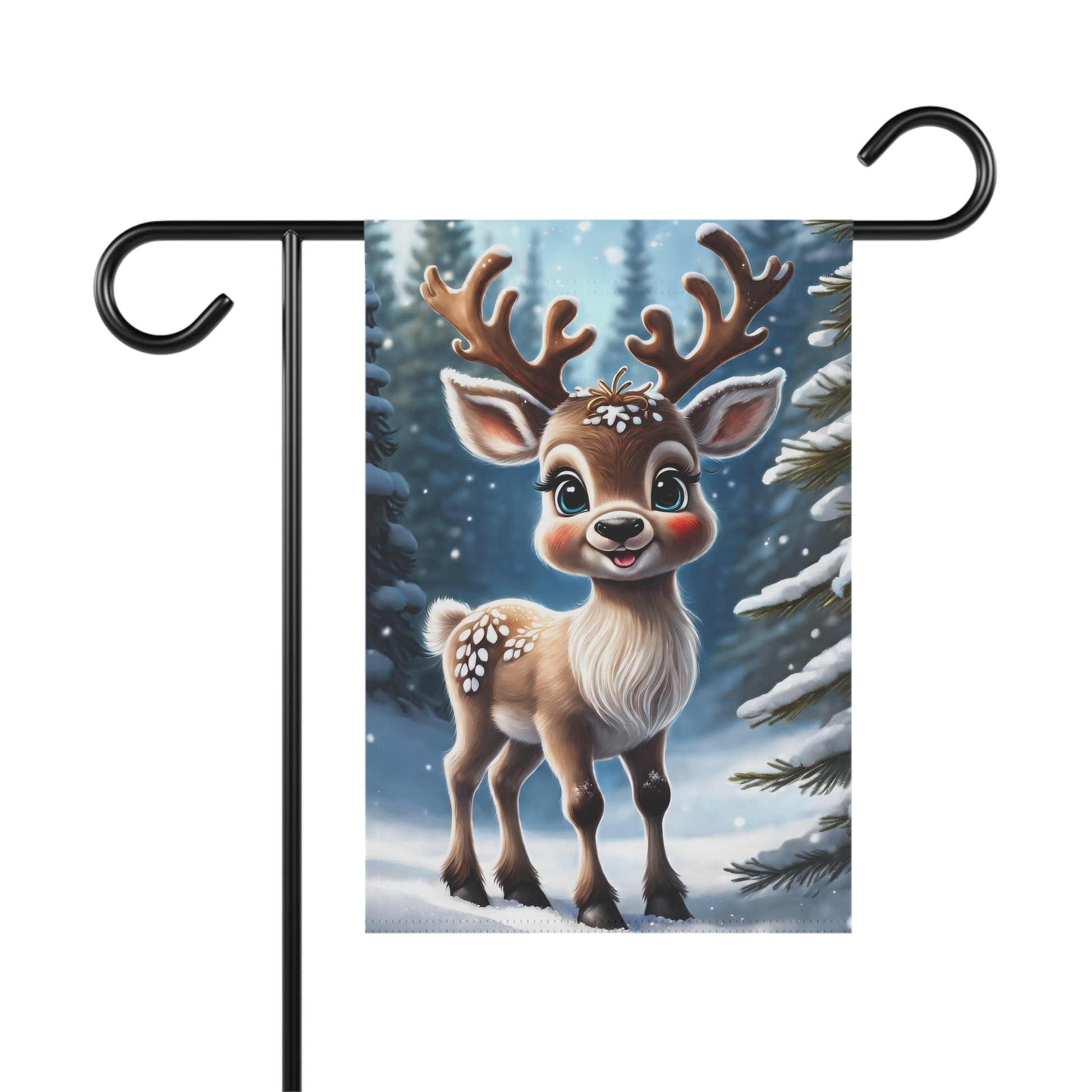 Adorable smiling reindeer garden flag with big antlers and rosy cheeks, in a snowy forest with frosted pine trees, on a black metal garden flag stand.

