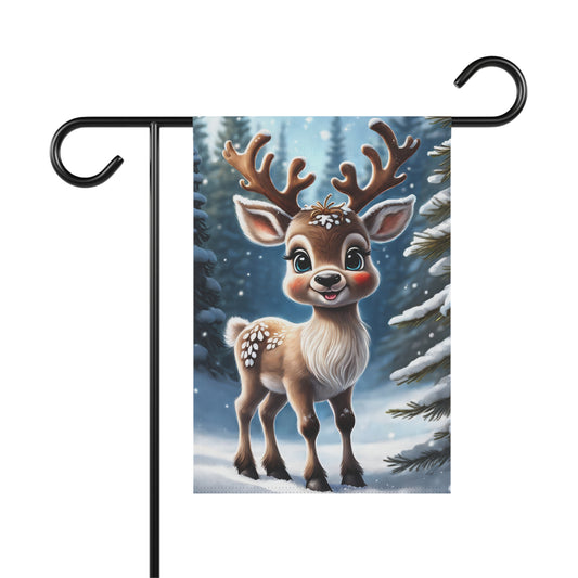Adorable smiling reindeer garden flag with big antlers and rosy cheeks, in a snowy forest with frosted pine trees, on a black metal garden flag stand.

