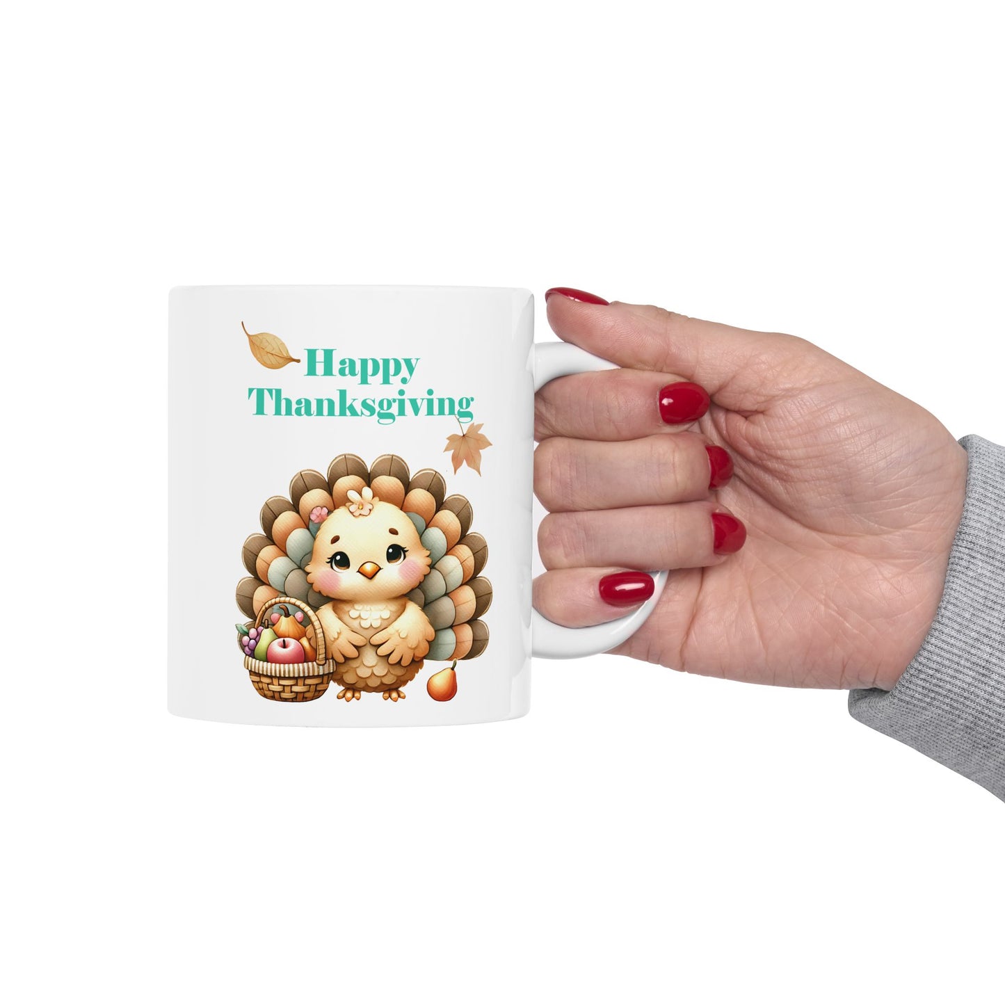 White ceramic mug with cute cartoon turkey and "Happy Thanksgiving" text, sitting on a wooden table with greenery