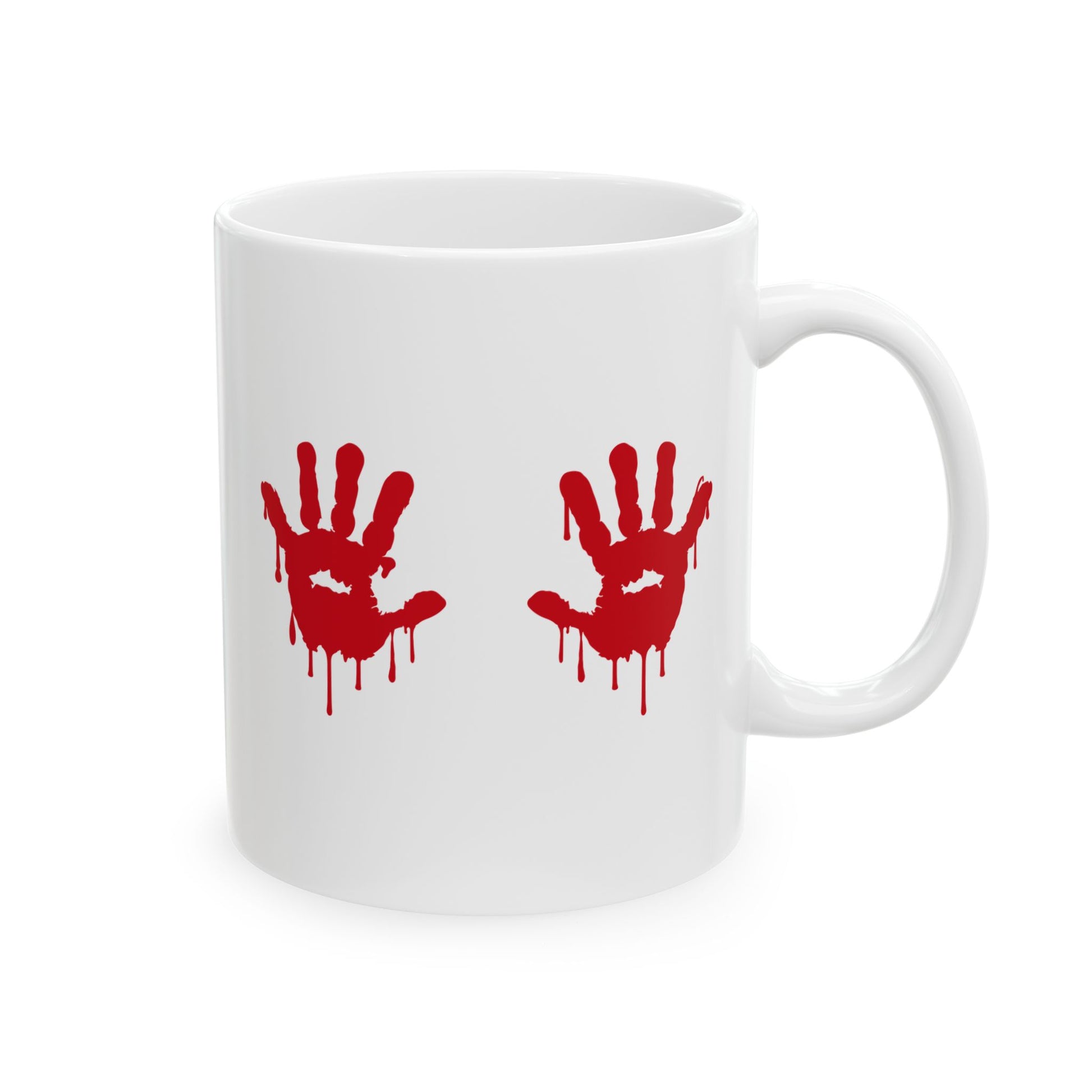 White ceramic coffee mug with two bright red, dripping handprints centered on the front surface, resembling bloody hand marks