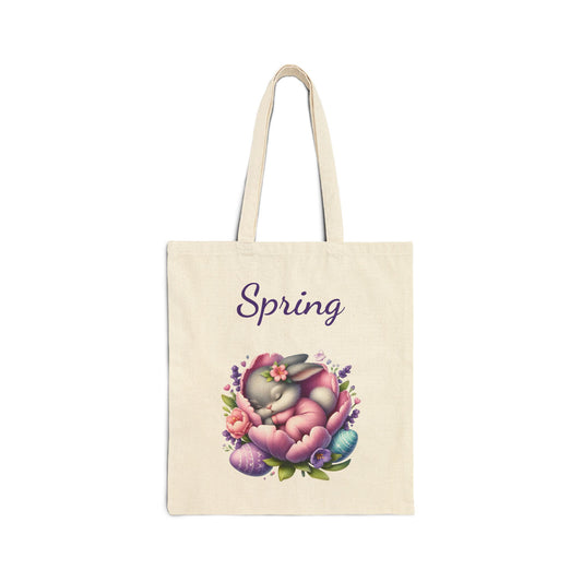 Canvas tote bag with a "Spring" print featuring a cute sleeping bunny in a floral nest with Easter eggs.
