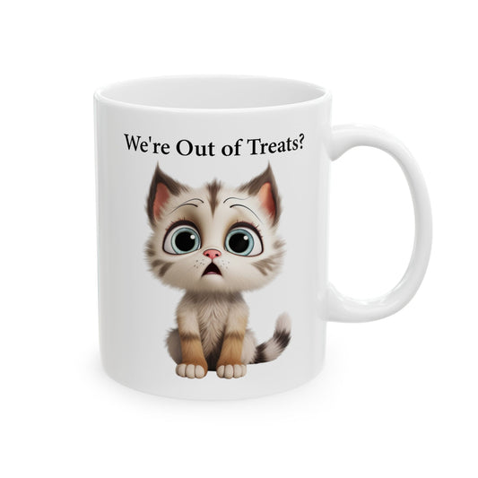 White ceramic coffee mug with a cartoon illustration of a cute, slightly sad or shocked brown and white tabby kitten with large blue-green eyes, and black text above reads "We're Out of Treats?".