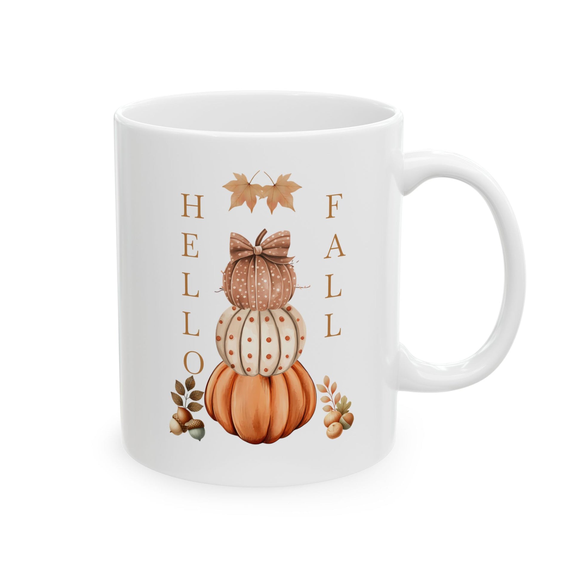 White ceramic coffee mug with a watercolor illustration of three stacked pumpkins (orange, patterned, and brown patterned with a bow), with "Hello Fall" written vertically on the sides, and fall leaves and acorns.