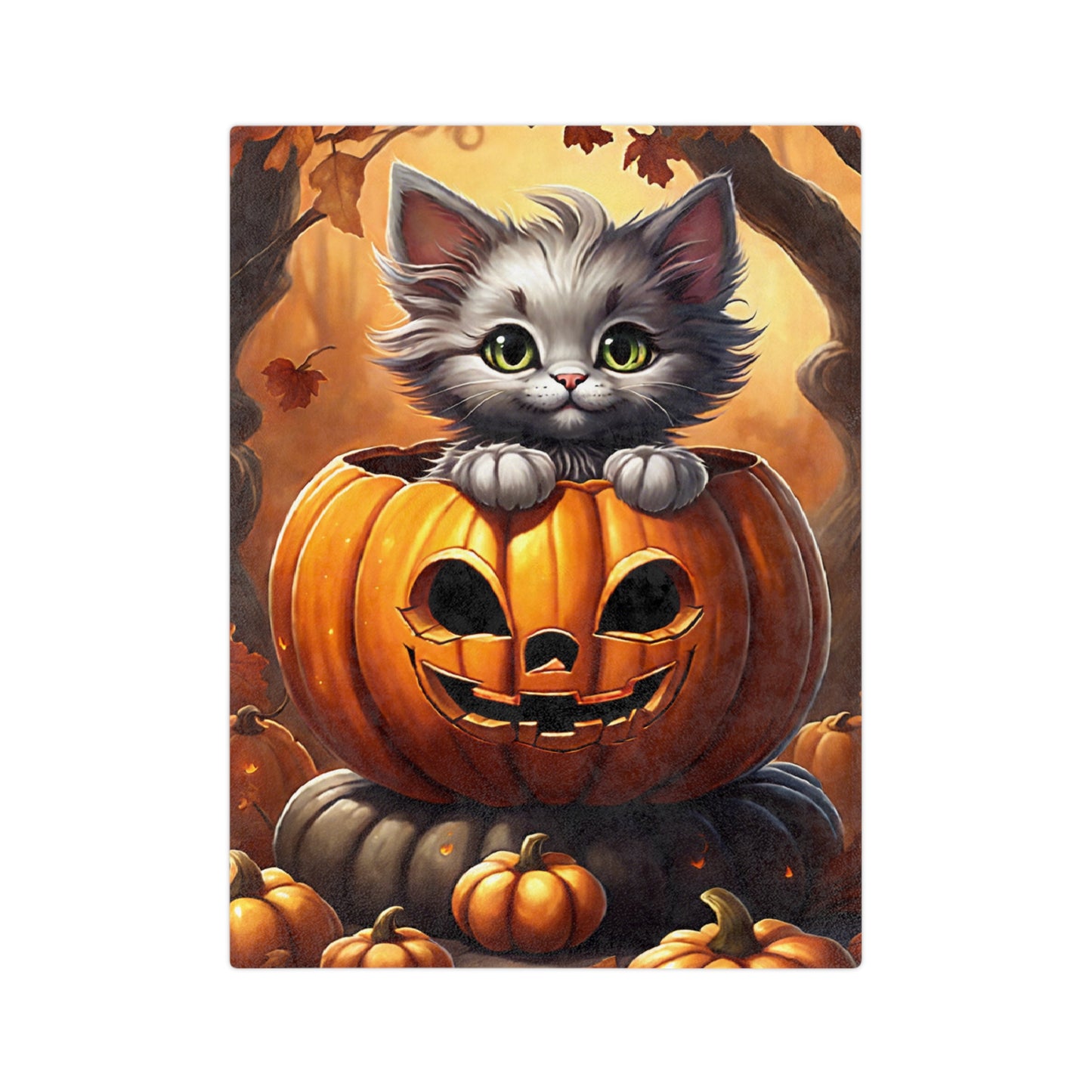 A plush fall blanket featuring a cute, fluffy grey kitten with green eyes peeking out of a carved Halloween jack-o'-lantern in a warm, autumnal forest.

