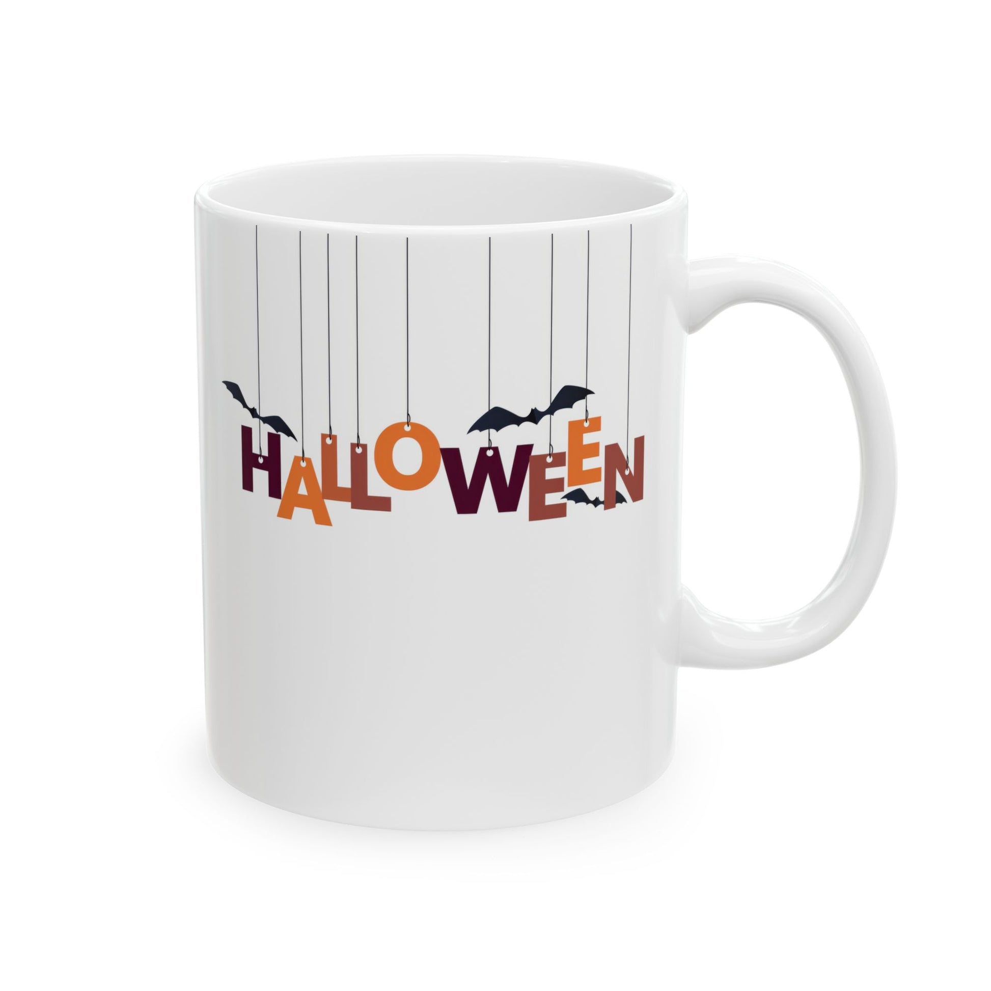 White ceramic coffee mug with the word 'HALLOWEEN' spelled out in hanging orange and purple letters, with black bat silhouettes, on a white background