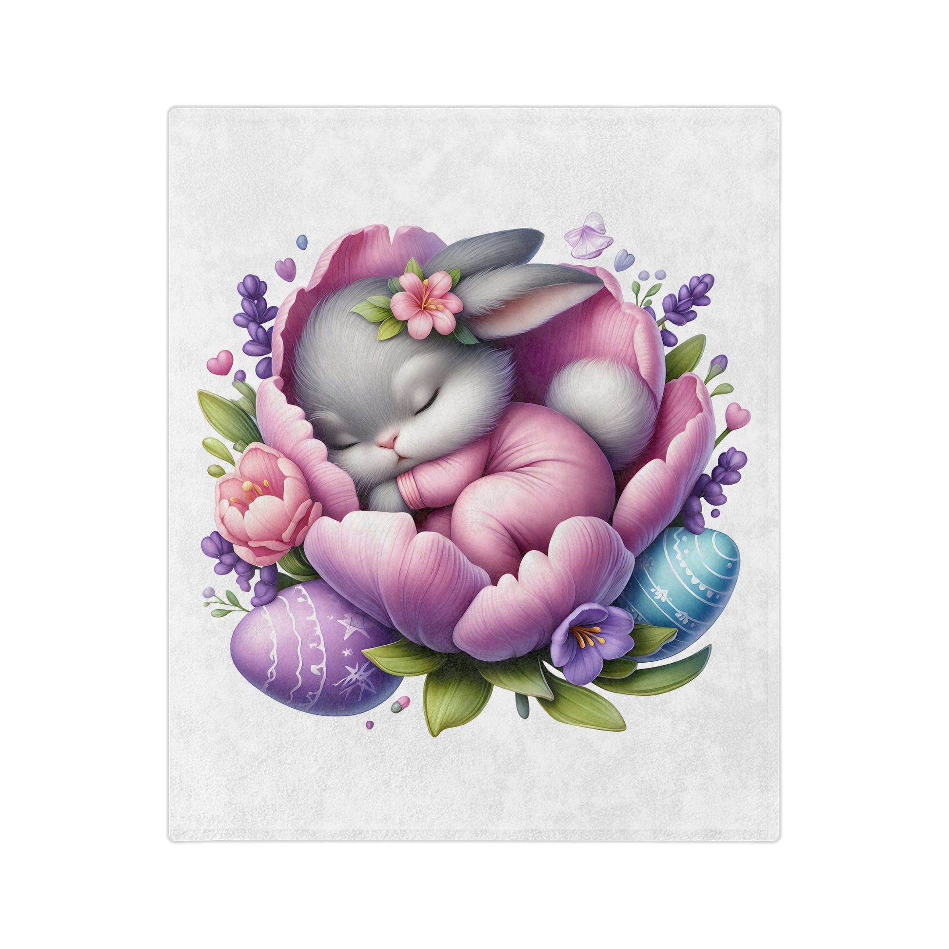 Lightweight white velveteen blanket with a central illustration of a gray bunny wearing pink pajamas, sleeping peacefully inside a large pink and purple flower, surrounded by decorated Easter eggs and spring leaves.

