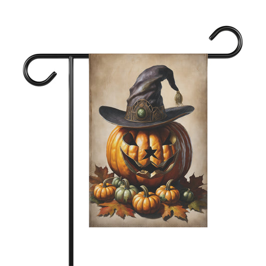 Rustic Halloween garden flag featuring a carved jack-o'-lantern with a witch hat surrounded by mini pumpkins and autumn leaves