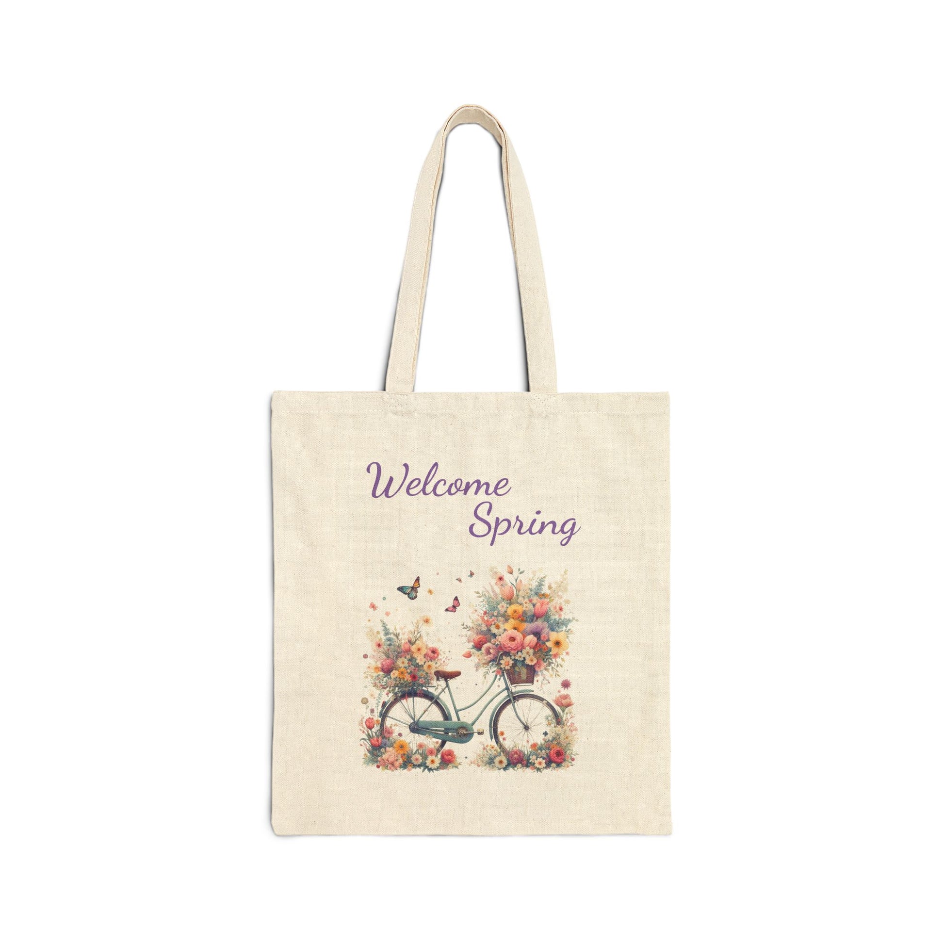 Canvas tote bag with a "Welcome Spring" print featuring a vintage bicycle with baskets full of flowers.