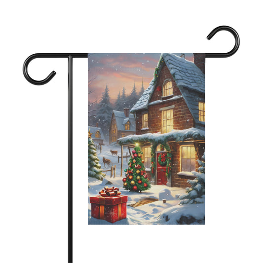 Christmas cottage garden flag with snow-covered roof, decorated Christmas tree, and a large red gift box in the snow, festive holiday outdoor decor.

