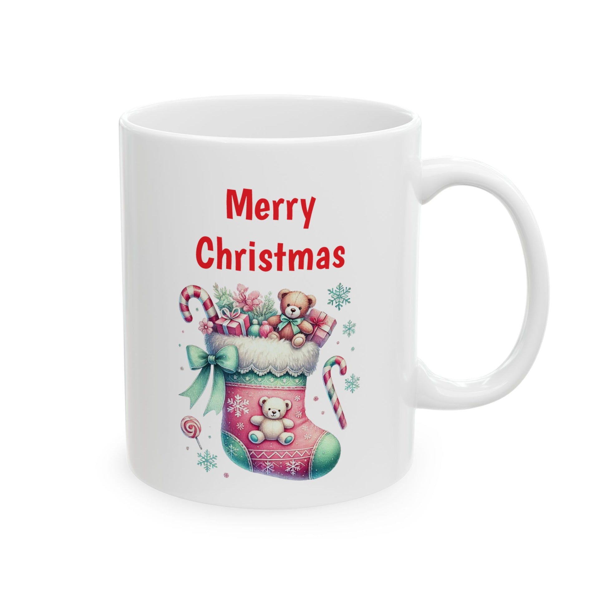 White ceramic coffee mug with a watercolor illustration of a pink and green Christmas stocking overflowing with gifts, candy canes, and a teddy bear, with red "Merry Christmas" text above.